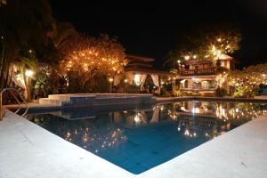 a house with a swimming pool at night at Casa Salome in Matas