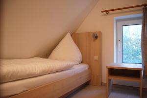 Кровать или кровати в номере Doppelhaushälfte in Vitte auf Hiddensee