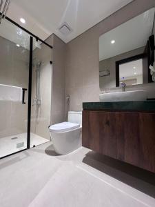a bathroom with a toilet and a sink and a shower at Moon Inn Apartment-self check in in Hanoi +33 photos