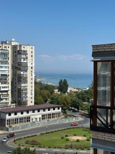 a view of a city with a street and buildings at ЖК Парус, 10-1 in Chornomorsk