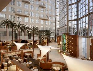 a view of the lobby of a building with palm trees at Hyatt Regency Orange County in Anaheim