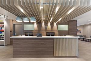 a lobby of a store with a reception counter at Home2 Suites By Hilton Calera in Calera +43 photos