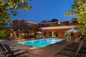 a swimming pool in front of a building at DoubleTree by Hilton Akron Fairlawn in Fairlawn
