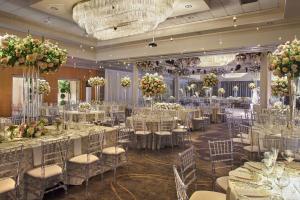 a banquet hall with tables and chairs and flowers at DoubleTree by Hilton Akron Fairlawn in Fairlawn +80 photos