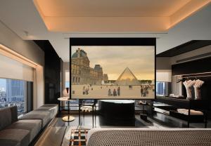 a living room with a large picture of the pyramids at SEYA Design Hotel - Chengdu Taikoo Li - Managed by SEYA GROUP in Chengdu