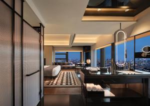 a bathroom with a view of a bed and a sink at SEYA Design Hotel - Chengdu Taikoo Li - Managed by SEYA GROUP in Chengdu