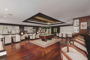 a room with a pool table and some chairs at Hunas Falls in Kandy