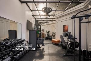 a fitness room with treadmills and exercise equipment at NIA Hotel in Da Lat
