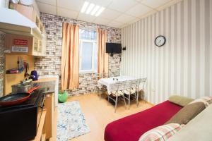 a kitchen and dining room with a table in it at Basic Apartment for up to 5 guests in Burgas