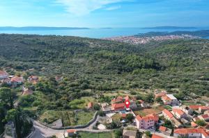 an aerial view of a small town on a mountain at Islander house with pool in Trogir +48 photos