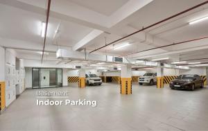 a large parking garage with cars parked in it at NIA Hotel in Da Lat