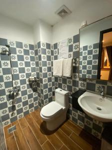 a bathroom with a toilet and a sink at Sun Nova Home Phu Quoc in Phú Quốc +53 photos