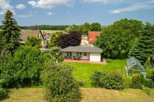 an aerial view of a house with a yard at Bungalow Becker "Am Feldrand" in Jennewitz +9 photos