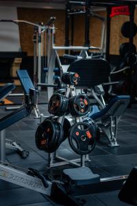 a gym with a bunch of helmets on a rack at Santat Central hôtel in Bellac