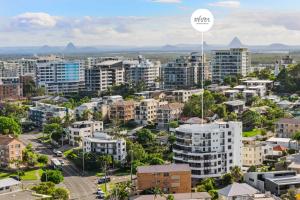 an aerial view of a city with buildings at Salt & Sky - Stylish Apartment with Pool & Spa in Caloundra
