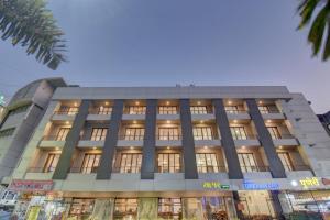 a large building with many windows at Hotel Dreamland in Pune