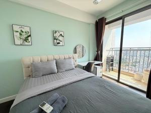 a bedroom with a large bed and a large window at Dear You, Apartment! Saigon - Rivergate Building in Ho Chi Minh City +179 photos