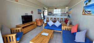 a living room with a couch and a table at Seabrook 404 - Sleeps 8 in Margate