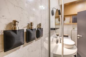 a bathroom with a toilet and a sink at V Luxury Apartment in Split +34 photos