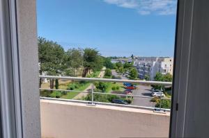 a view of a city street from a balcony at Pleasant Studio in Saint-Brieuc