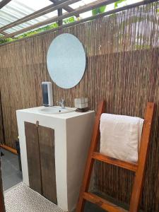 a bathroom with a sink and a mirror at Entire home in General Luna in General Luna +6 photos