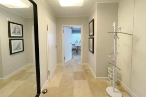 a hallway with a mirror and a table at Ferienwohnung Goede Tiid in Tinnum +19 photos
