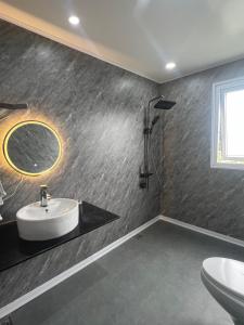 a bathroom with a sink and a mirror at Khế Homestay Phố Cổ Ninh Bình in Ninh Binh +65 photos