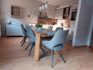 a dining room table and chairs in a kitchen at Haus Schwalbennest in Dahme