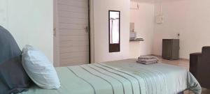 a bedroom with a bed with two towels on it at Alldays Sunset Lodge Wilde Street in Alldays