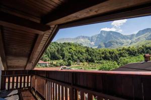 a view of mountains from a balcony of a house at Apartma Luna with mountain view in Kobarid
