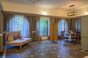 a living room with a couch and a table at The Bagheera Heritage, Jaipur in Jaipur
