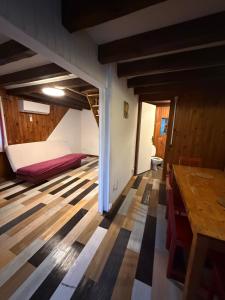 a room with a bed and a table in a room at LK gîte la forêt in Chénérailles