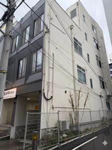 a white building on the side of a street at 亀井町Stay201 in Takamatsu +3 photos