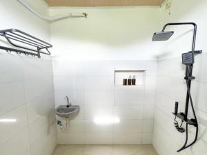 a bathroom with a shower and a sink at La Casa de Maria in Komodo Labuan Bajo Airport +13 photos