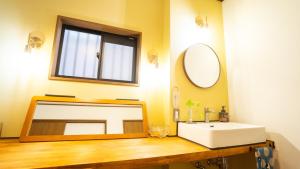 a bathroom with a sink and a mirror at mintstay kochi in Kochi +33 photos