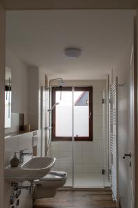 a bathroom with a sink and a toilet and a shower at Wolke 7 – PEAK Andreasberg in Sankt Andreasberg +15 photos