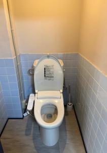a bathroom with a toilet with a remote control at 亀井町Stay202 in Takamatsu +3 photos