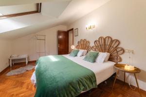 a bedroom with a large bed in a room at Apartamento Bautista Centro in Cangas de Onís +20 photos