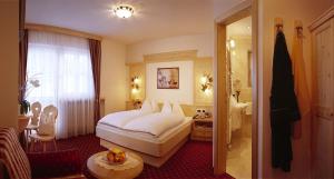 A bed or beds in a room at B&B Appartments Cudlea