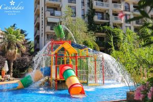 a water park in a resort with a water slide at Cascadas Family Resort in Sunny Beach