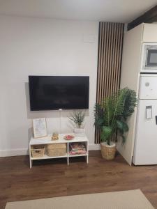 a living room with a flat screen tv on a wall at R2R - Pisuco Salvé Experiencia Única con Audioguía Privada en Laredo - C28A01 in Laredo