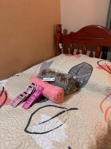 a pile of items on top of a bed at Electra hospedaje familiar in Chicoana