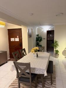 a dining room with a table and chairs at ترف in Medina