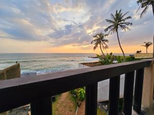 a view of the ocean from a balcony at Villa Sea View in Galle