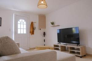 a living room with a large flat screen tv at Les Embruns, 4 personnes in Criel-sur-Mer
