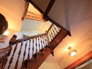 a staircase in a house with a light on the ceiling at Harbourview Inn in Smiths Cove +21 photos