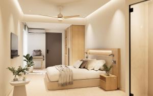 a bedroom with a bed and a television in it at Ekavi Hotel in Sfakaki +24 photos