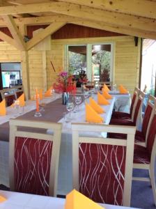 a dining room with a long table with chairs at Bibina in Levoča