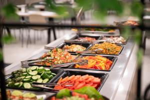 a buffet line with many different types of food at כפר נופש קלי"ה ים המלח in Kalia