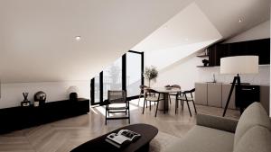 a living room with a couch and a table at Lakeside Studios Konstanz in Konstanz